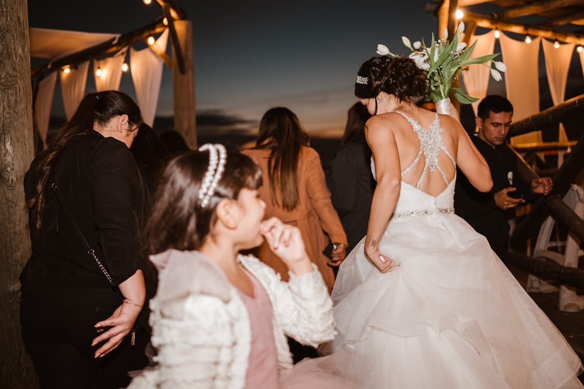 Bride and guests dancing at an evening reception